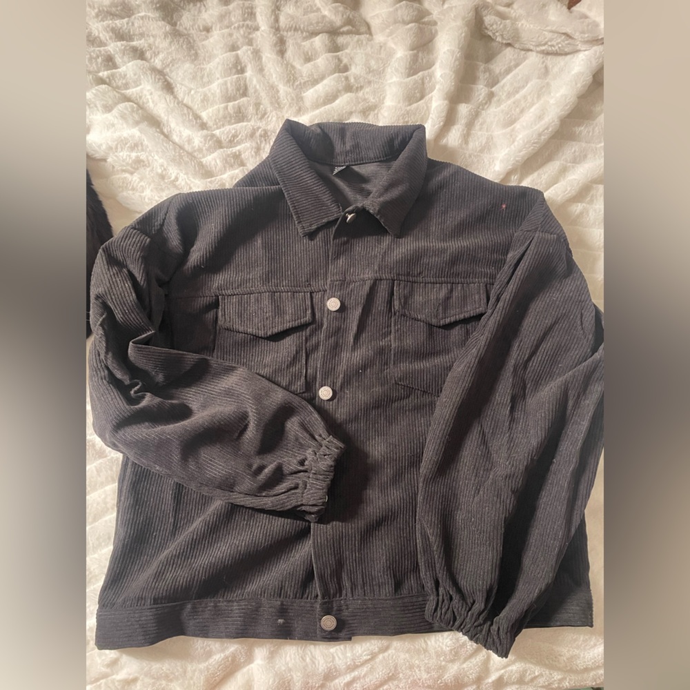 Woman’s black button up jacket
